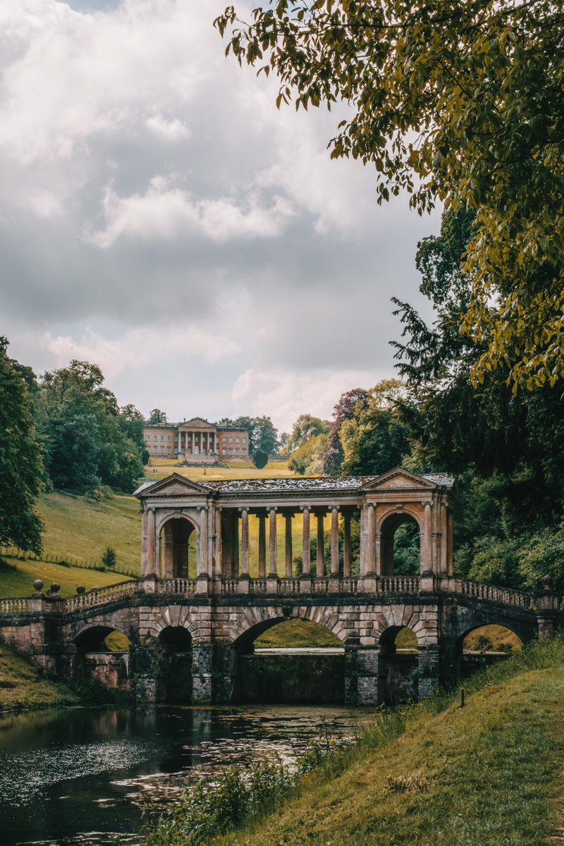 Palladian bridge over river in Prior Park, Bath