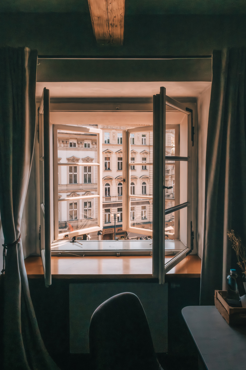 Open window overlooking Prague architecture at Miss Sophie's