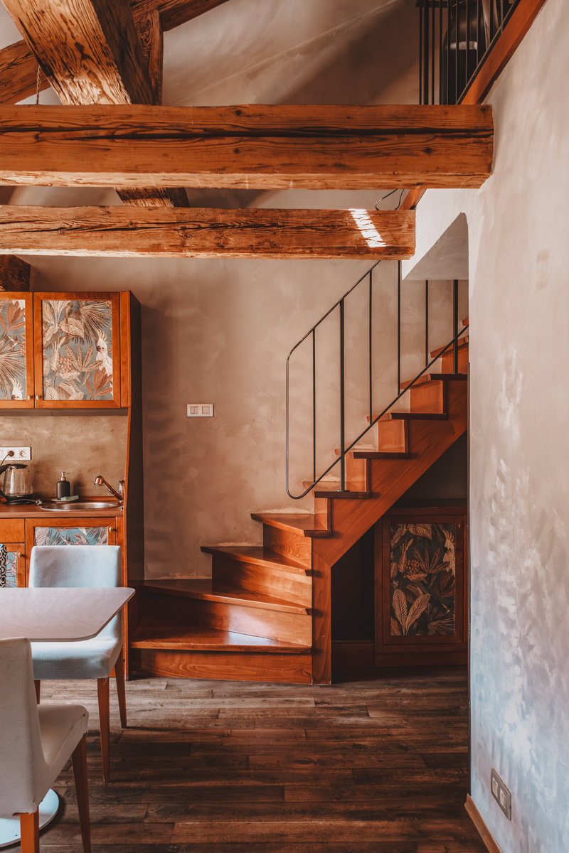 Exposed timber staircase at Miss Sophie's, Prague