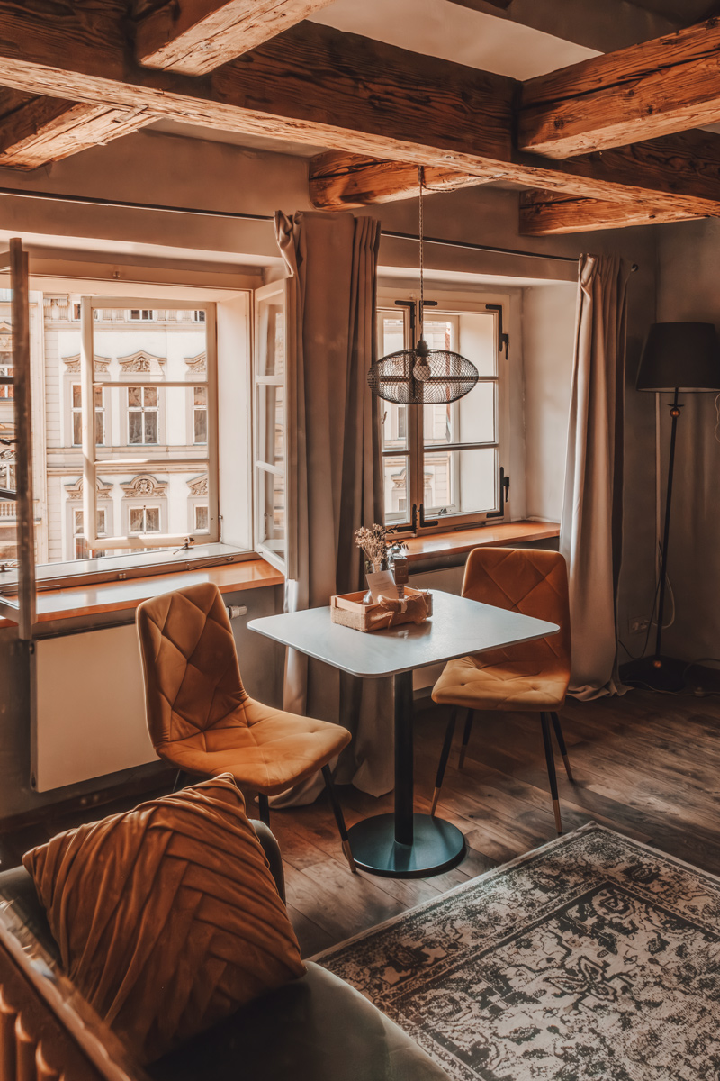 Warm sitting room with exposed beams at Miss Sophie's, Prague